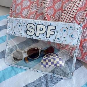 NEW KENZKUSTOMZ women's spf clear pouch in blue oysters